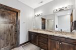 His and Her vanity in master bathroom along with stand up shower